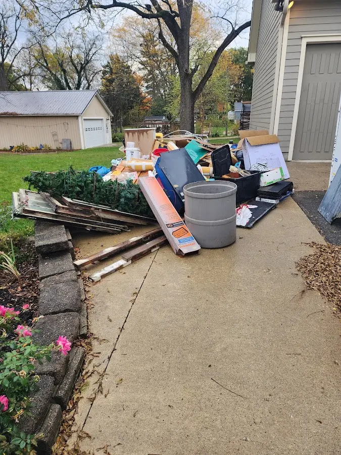 Dumpster being loaded with debris for 3 Yard Dumpster Rental in Barnstable Town